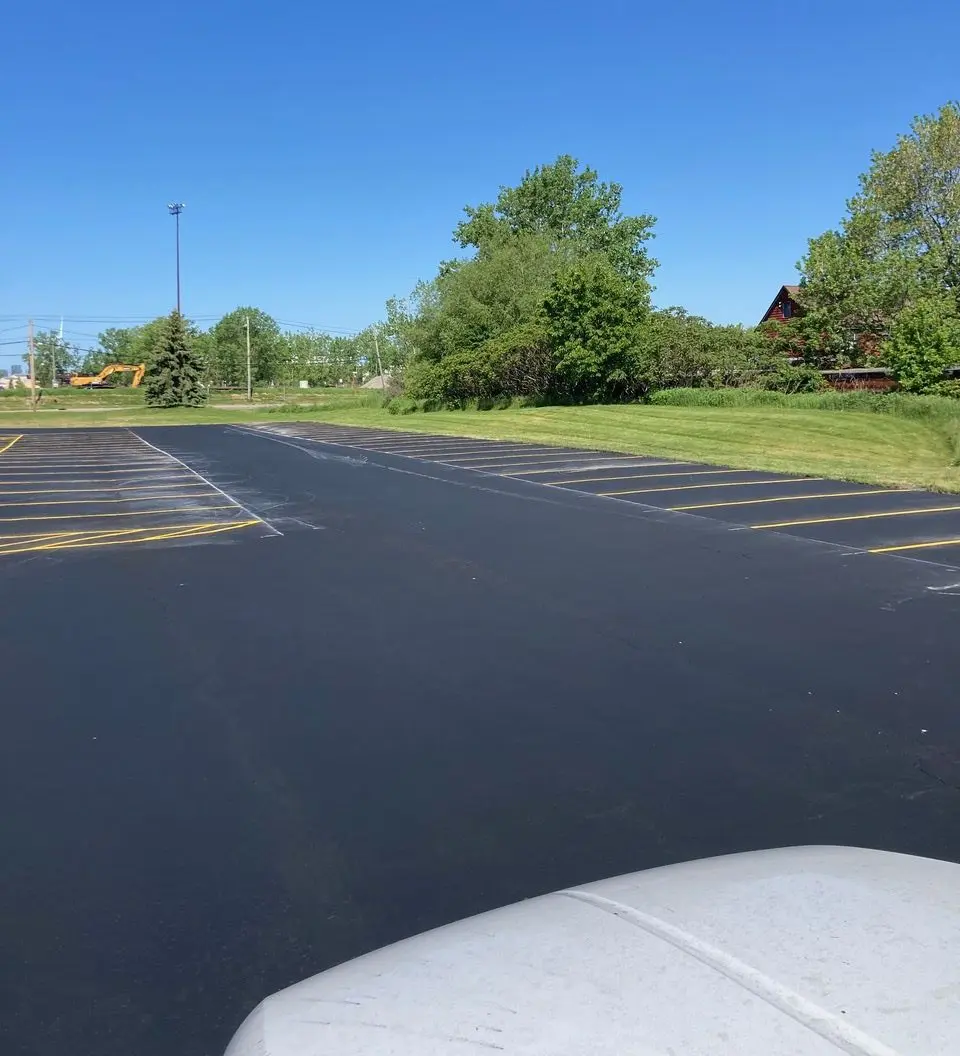 A view of an empty parking lot from the side.